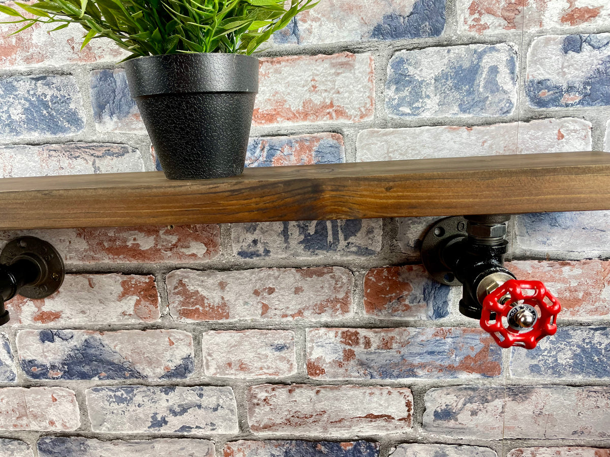 20cm x 10cm handmade industrial style shelf with metal pipework brackets and valves.

Made from solid wood and metal industrial style pipework, this unit is perfect for industrial or loft living style home decor and suitable to use anywhere around the home. Free UK delivery  by Splintered Furniture