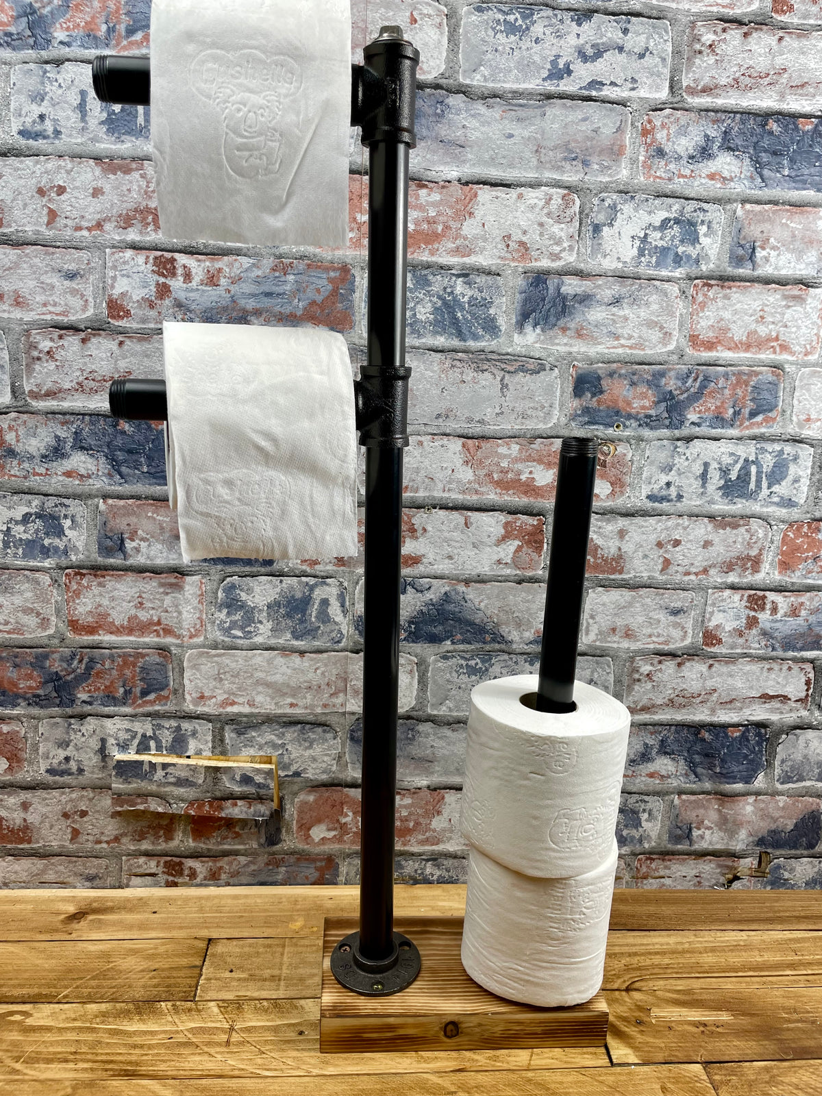 Industrial Style Pipework Free Standing Double Toilet Roll Holder &amp; Store.

Made to order industrial style pipework toilet roll holder with solid wood base in a choice of colours.