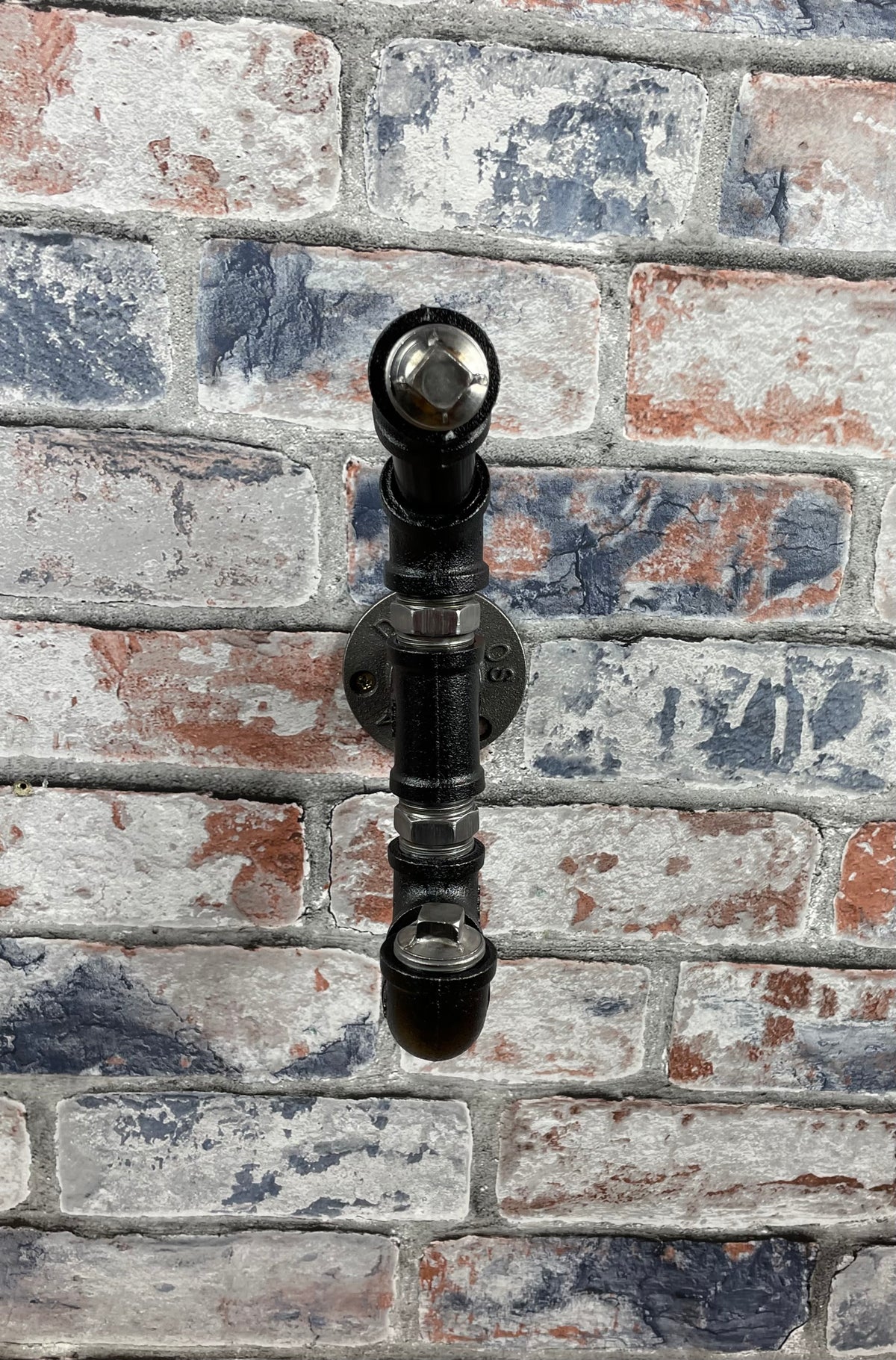 Industrial Style Metal Pipework Coat Hooks.

Chunky and super sturdy, these metal coat hooks come fully built and ready to attach to your wall.