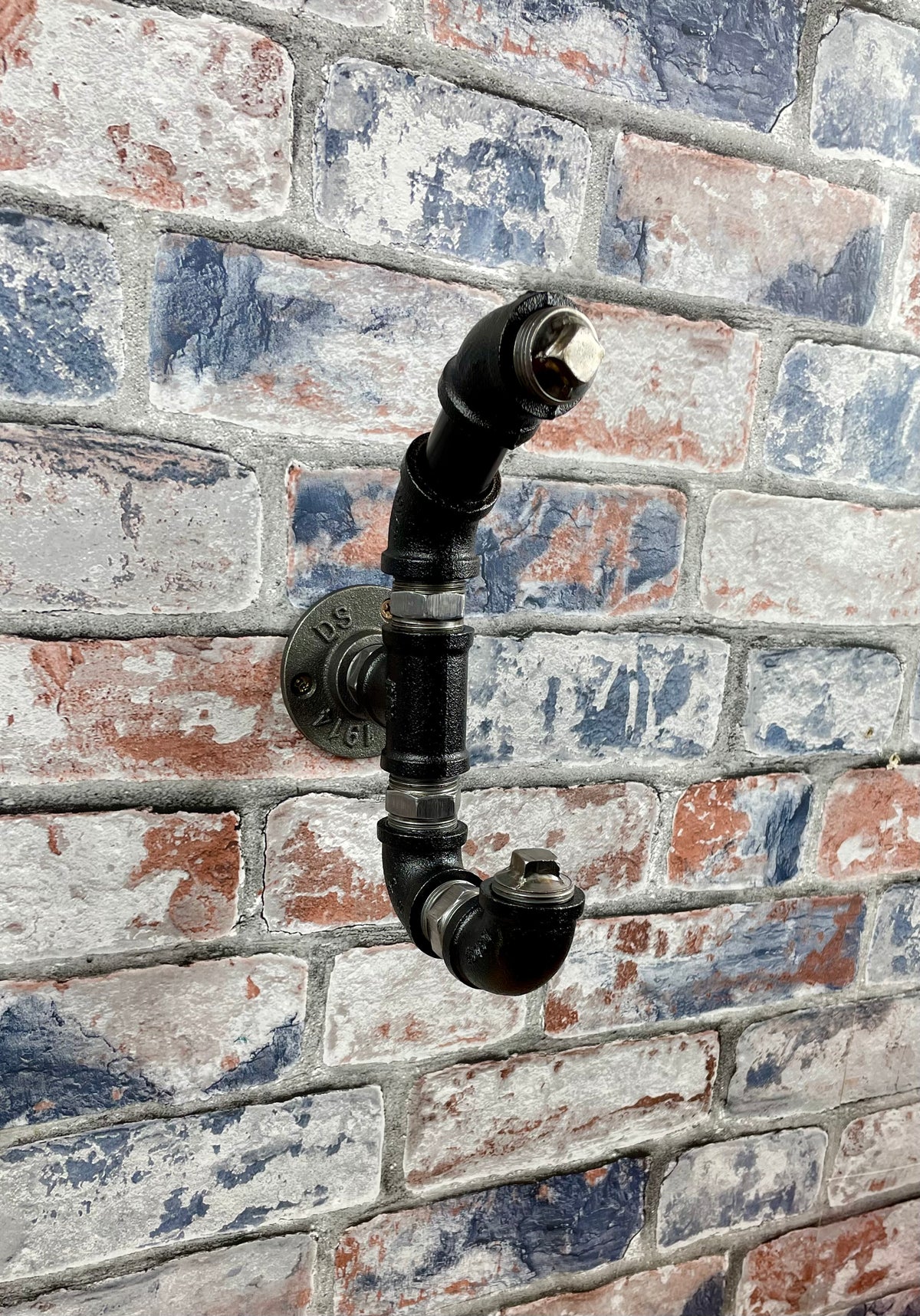 Industrial Style Metal Pipework Coat Hooks.

Chunky and super sturdy, these metal coat hooks come fully built and ready to attach to your wall.