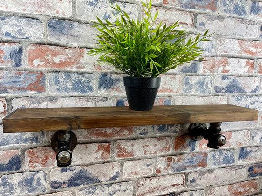 20cm x 10cm handmade industrial style shelf with metal pipework brackets.

Made from solid wood and metal industrial style pipework, this unit is perfect for industrial or loft living style home decor and suitable to use anywhere around the home.