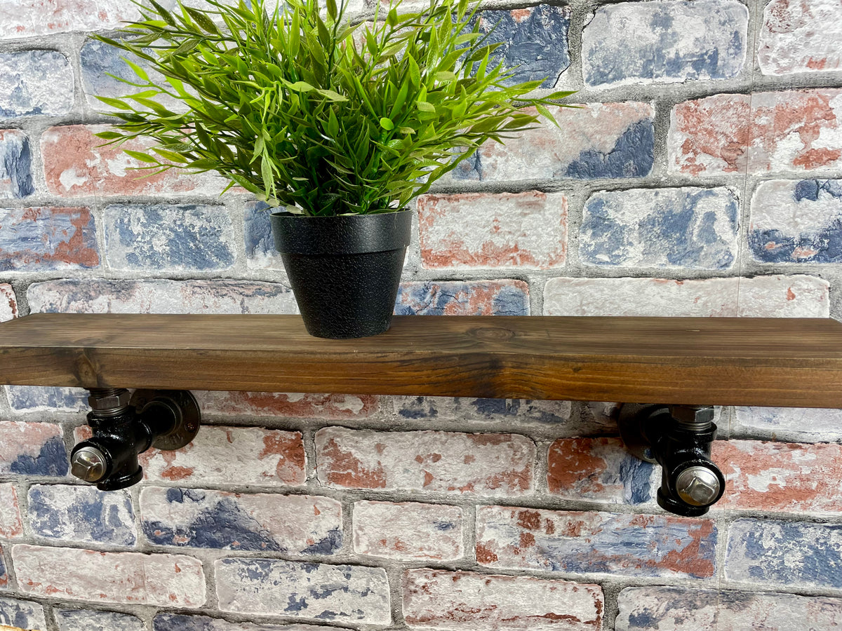 20cm x 10cm handmade industrial style shelf with metal pipework brackets.

Made from solid wood and metal industrial style pipework, this unit is perfect for industrial or loft living style home decor and suitable to use anywhere around the home.